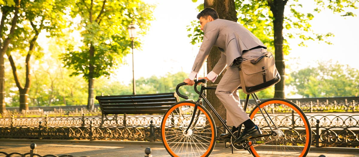 Business person riding bike