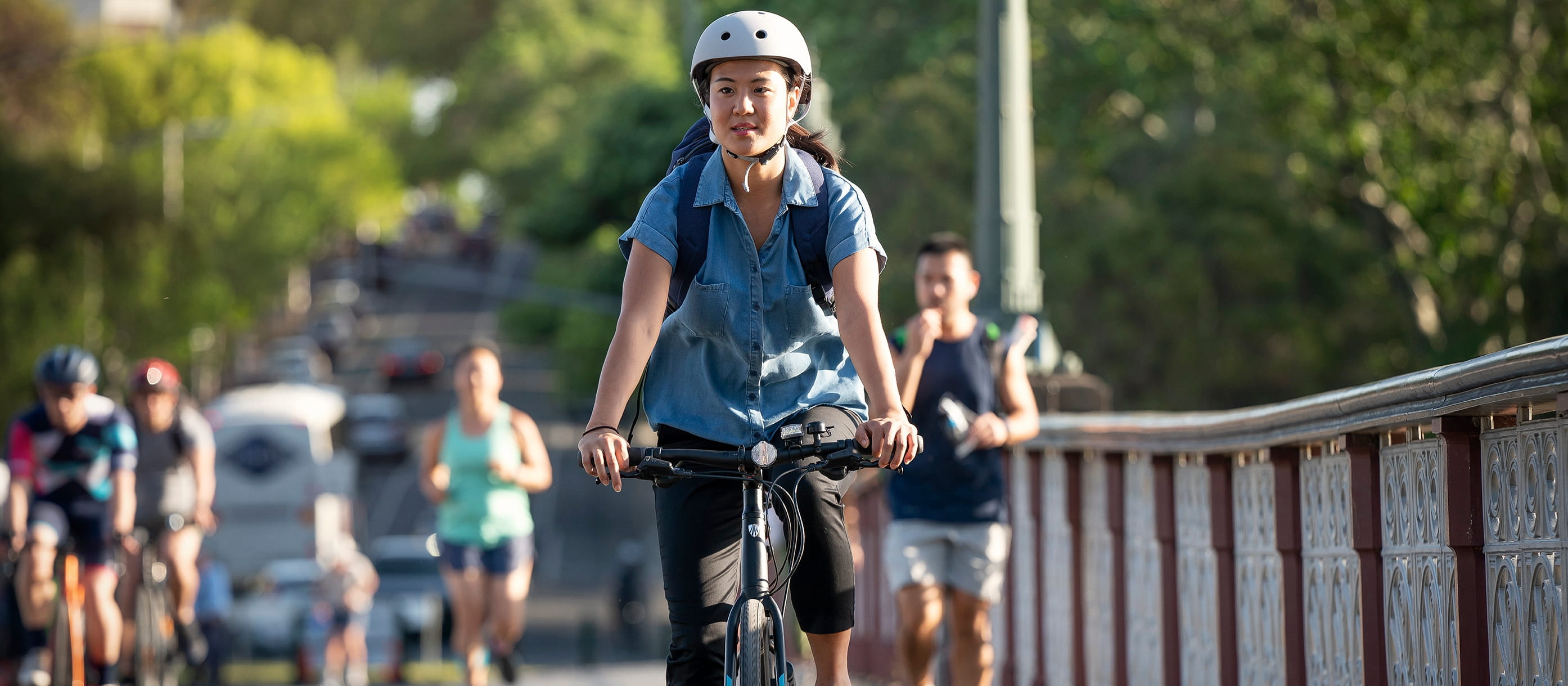 Woman riding a bike on a shared footpath