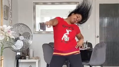 Woman dancing around her living room