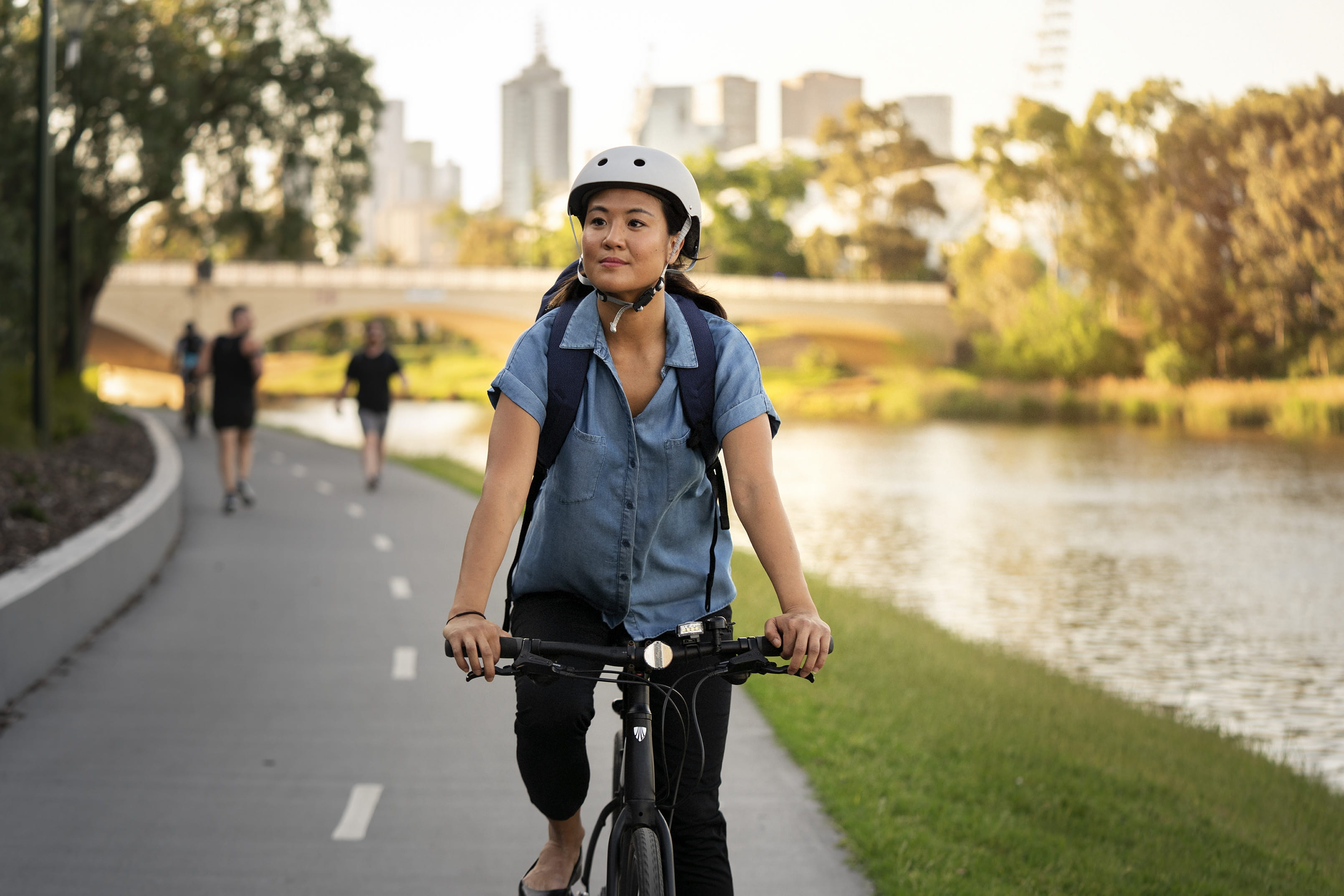 Woman riding a bike on shared path