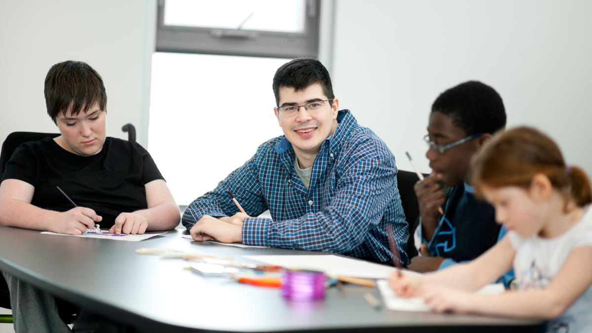 Young people with disabilities studying together