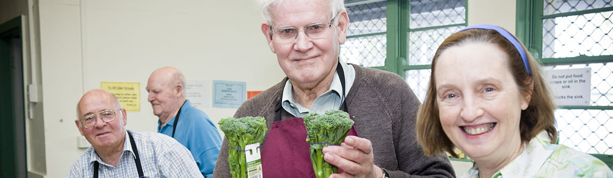 Older people with fresh fruit and vegetables