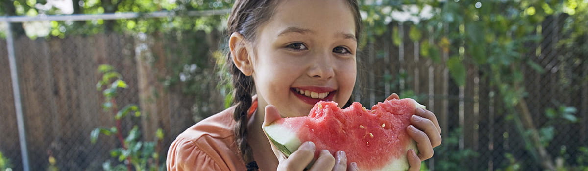 Girl eating a watermelon