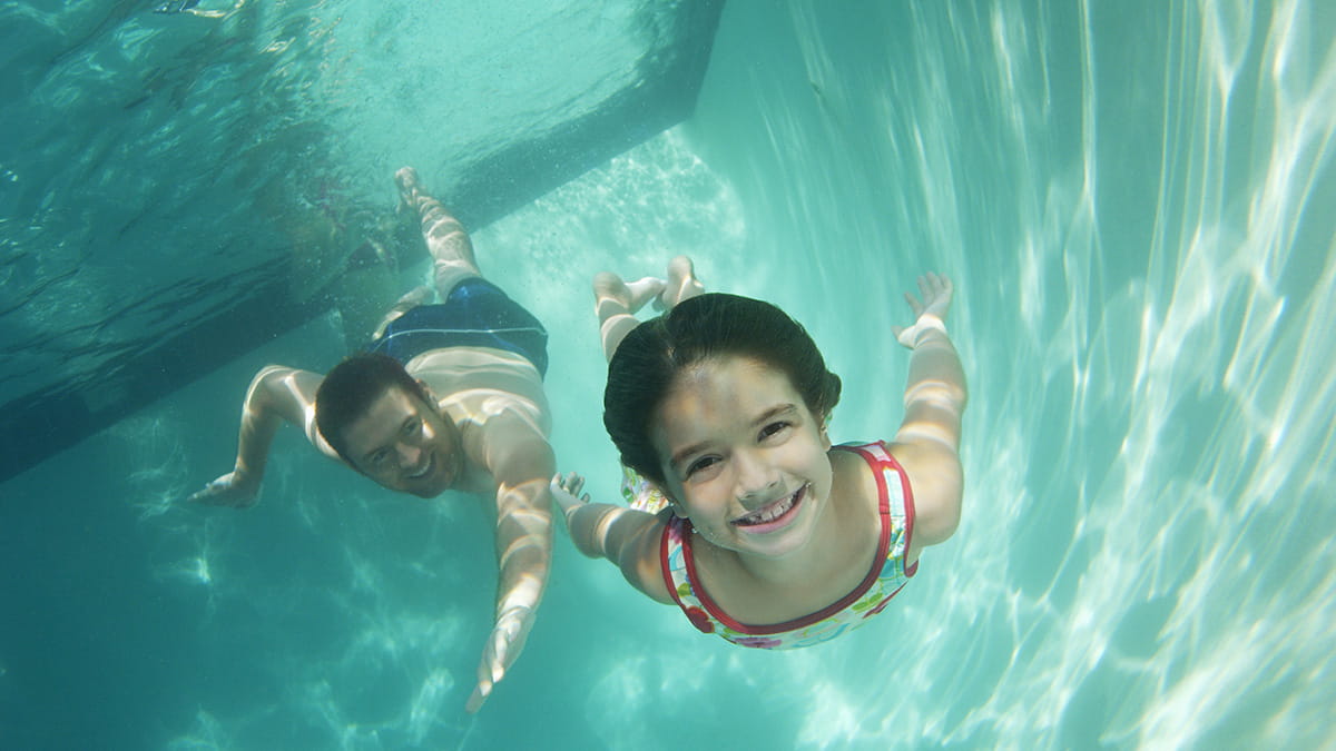 Child and parent swimming