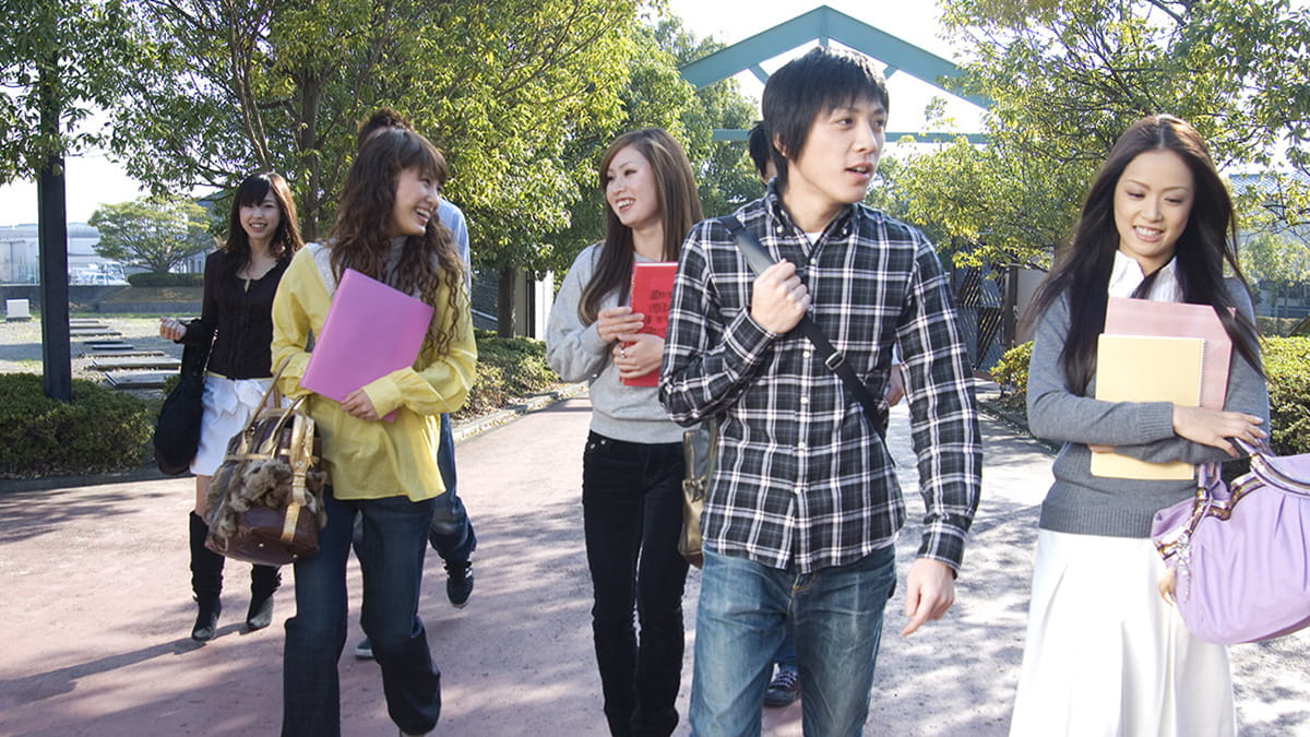 Male and female university students walking together