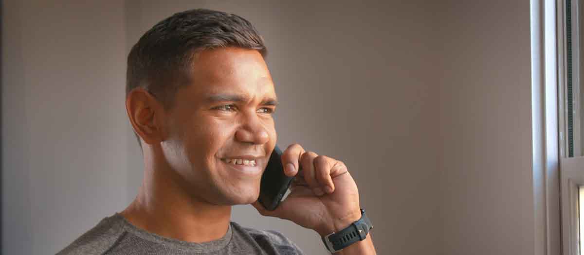 AFL Player Nev Jetta on the phone