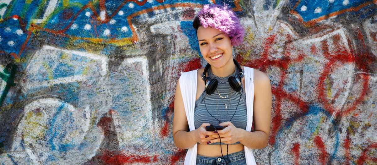 Young woman listening to headphones