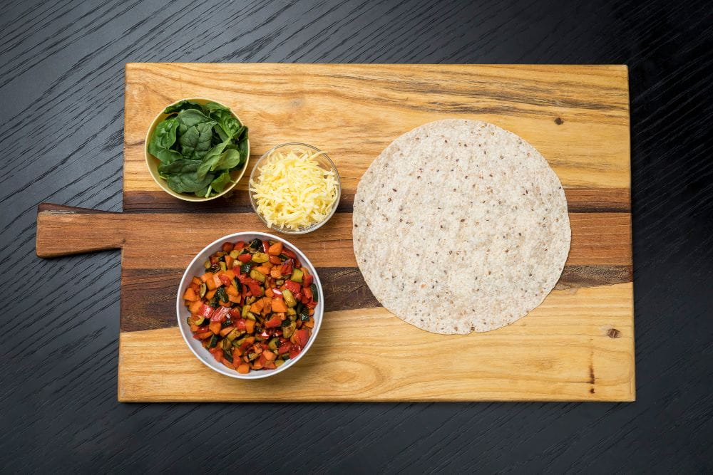 Image of quesadilla and assorted ingredients