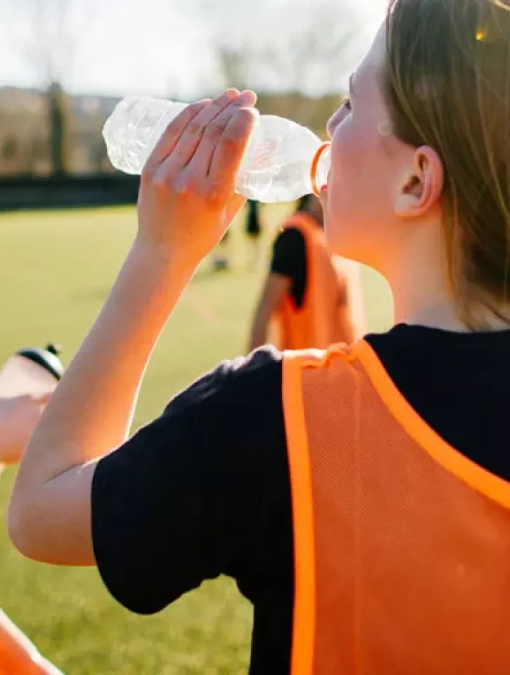 Sports team drinking bottles of water