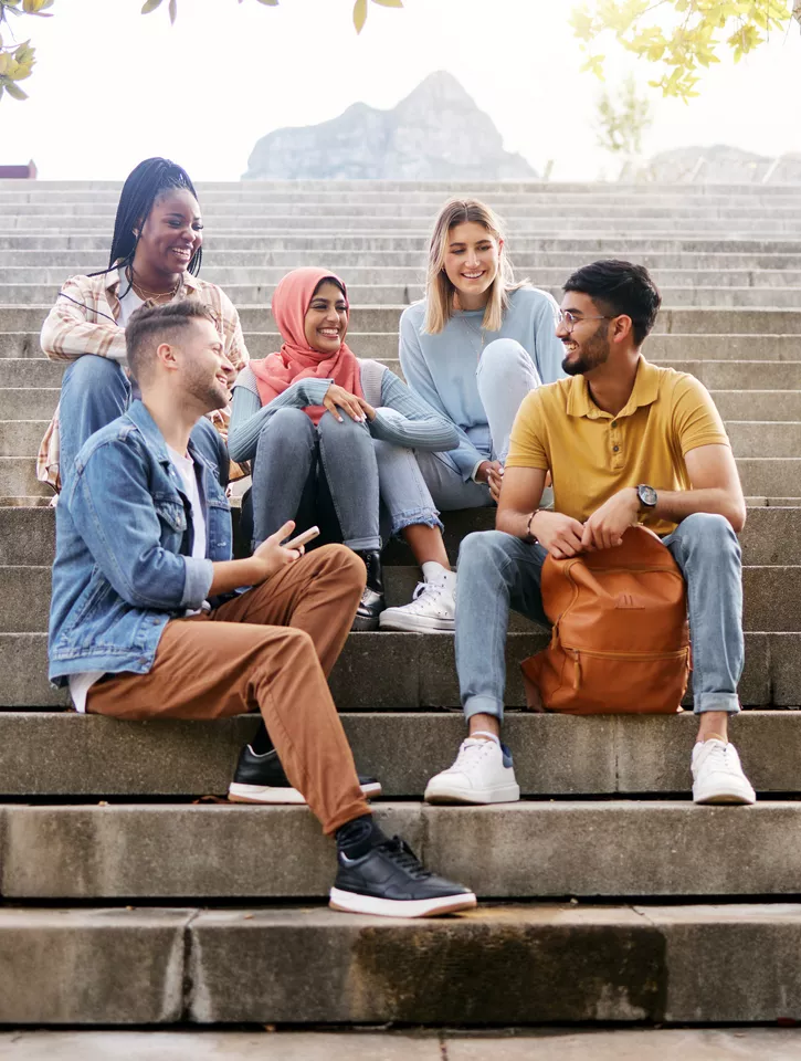 Young people sitting down in a group